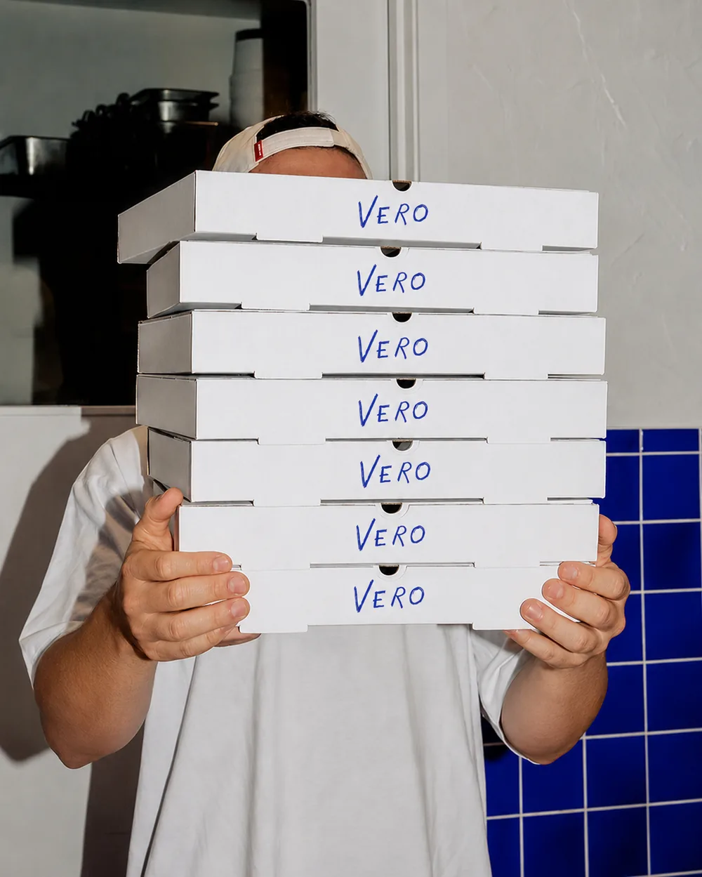 VERO-branded pizza boxes, ready to go